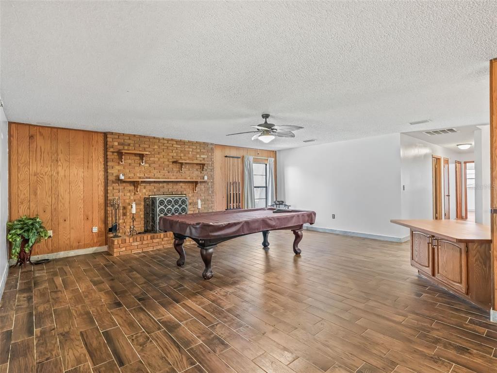 6350 Northeast 86th Avenue Bronson, FL 32621 - Photo 24 of 92 a view of a livingroom with furniture window and wooden floor