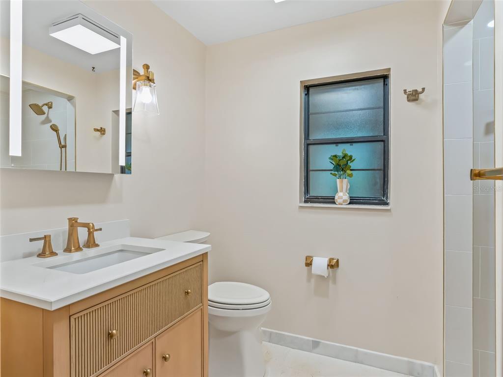6350 Northeast 86th Avenue Bronson, FL 32621 - Photo 32 of 92 a bathroom with a sink toilet and vanity