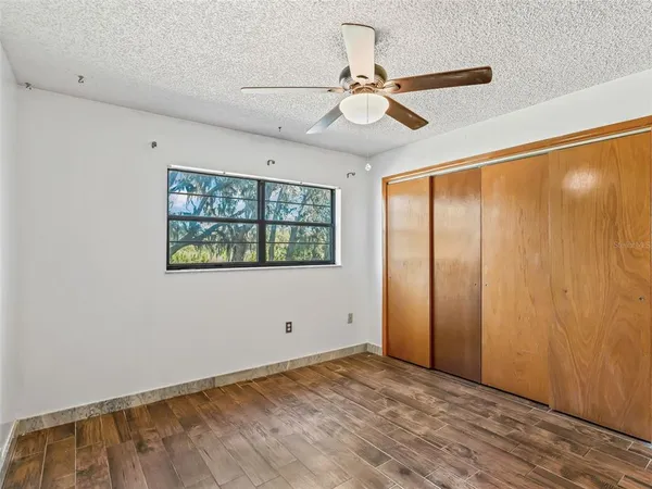 a view of a big room with windows and entryway
