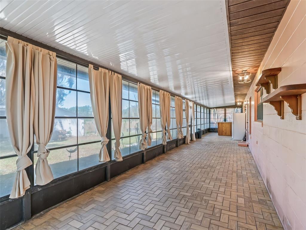 6350 Northeast 86th Avenue Bronson, FL 32621 - Photo 42 of 92 a view of a porch with wooden floor and iron stairs