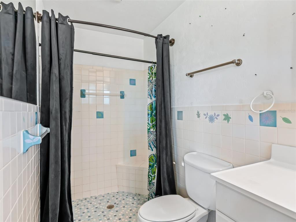 6350 Northeast 86th Avenue Bronson, FL 32621 - Photo 61 of 92 a white toilet sitting next to a bathroom sink