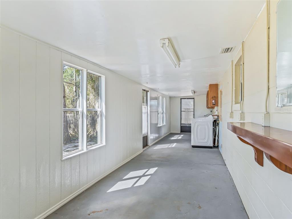 6350 Northeast 86th Avenue Bronson, FL 32621 - Photo 64 of 92 a view of a big room with windows and entryway
