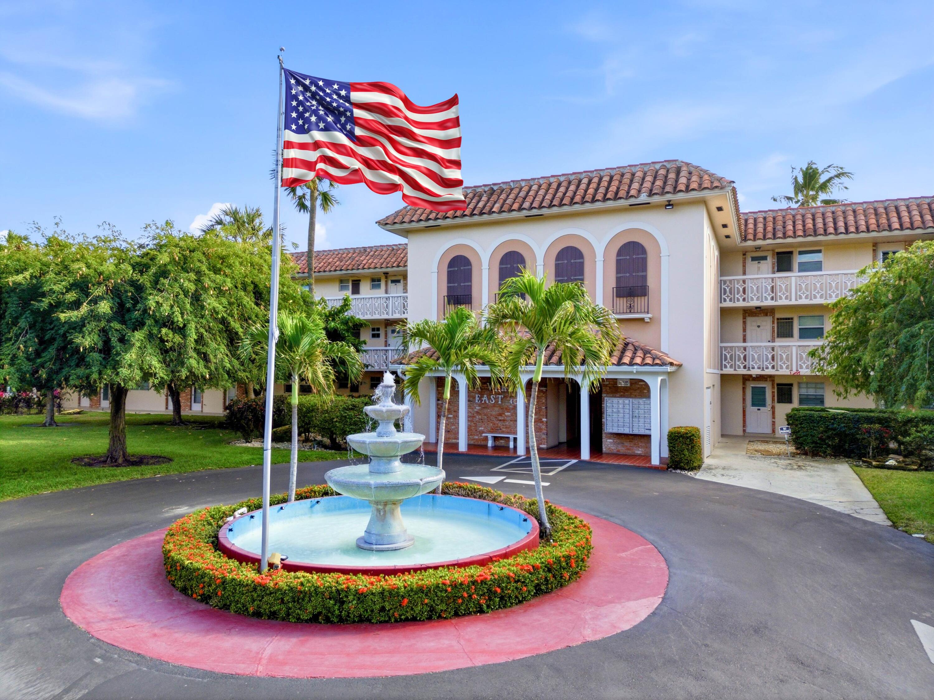 400 Northeast 20th Street, Unit A216 Boca Raton, FL 33431 - Photo 6 of 33 a front view of a house with a yard