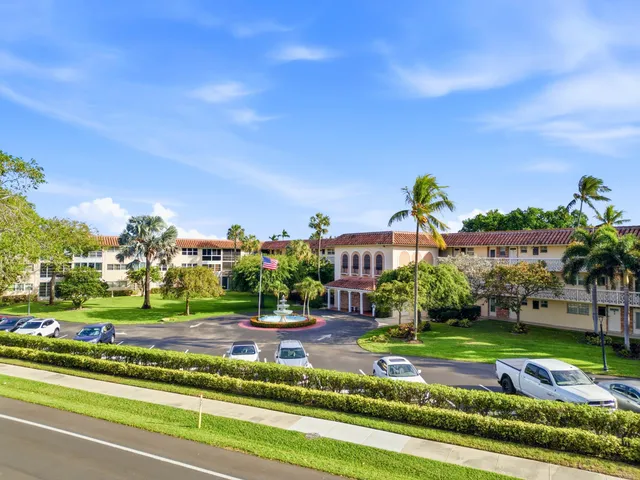 a dining room with furniture and garden view