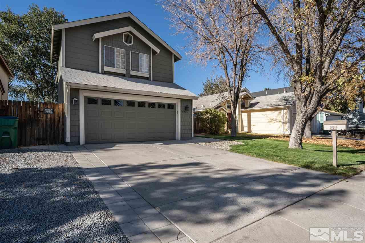 2741 Pajaro Place Reno, NV 89502 - Photo 1 of 36 a front view of a house with a yard and garage