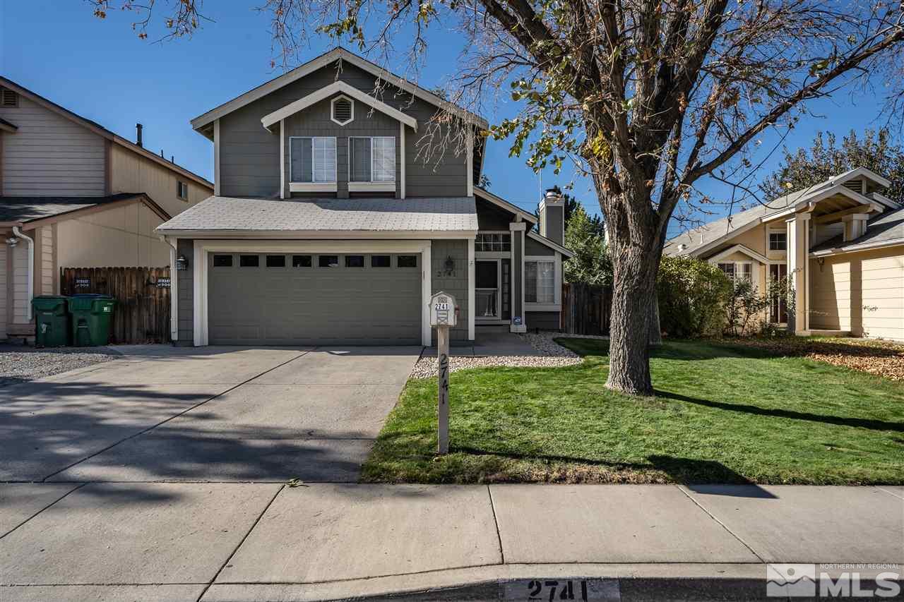 2741 Pajaro Place Reno, NV 89502 - Photo 2 of 36 a front view of a house with a yard and garage