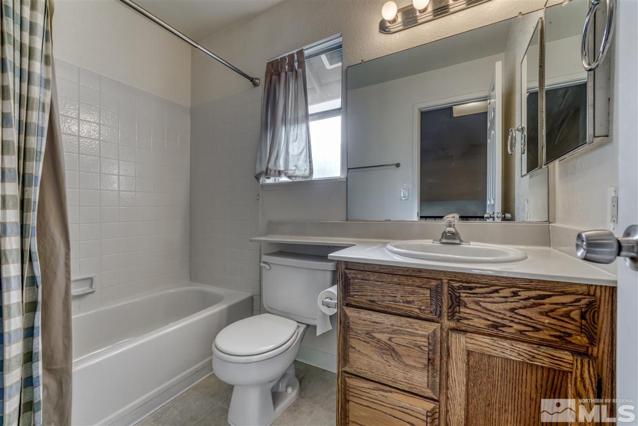 2741 Pajaro Place Reno, NV 89502 - Photo 21 of 36 a bathroom with a sink a toilet and shower