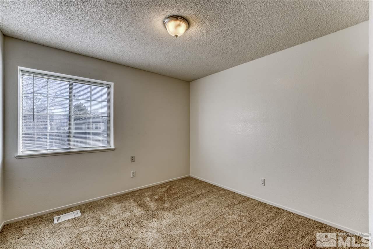 2741 Pajaro Place Reno, NV 89502 - Photo 24 of 36 an empty room with a empty space and windows