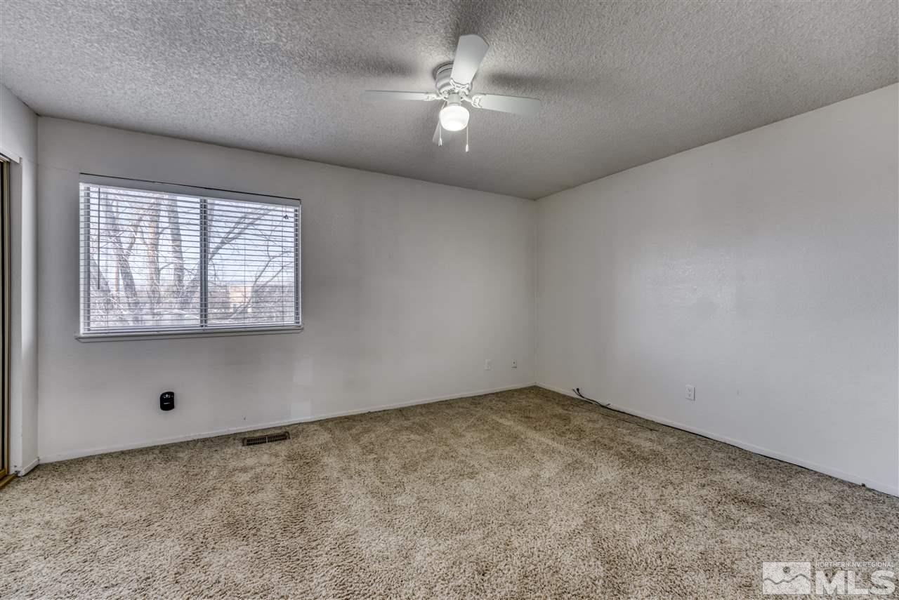 2741 Pajaro Place Reno, NV 89502 - Photo 28 of 36 an empty room with a window and a fan