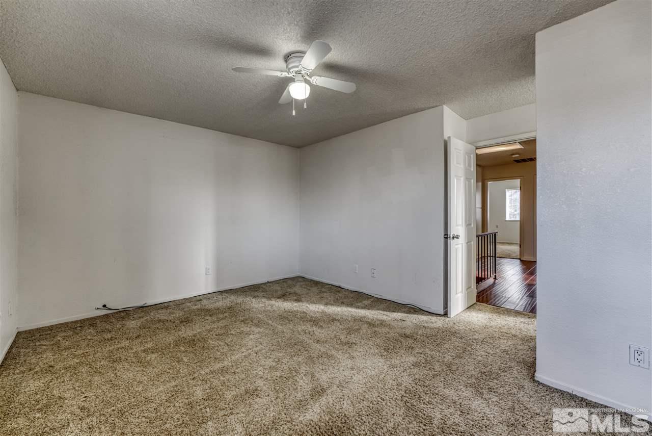 2741 Pajaro Place Reno, NV 89502 - Photo 29 of 36 an empty room with chandelier fan