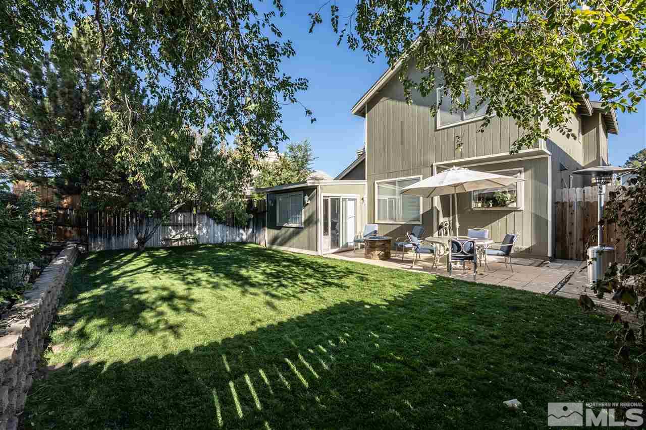 2741 Pajaro Place Reno, NV 89502 - Photo 32 of 36 a backyard of a house with yard and outdoor seating