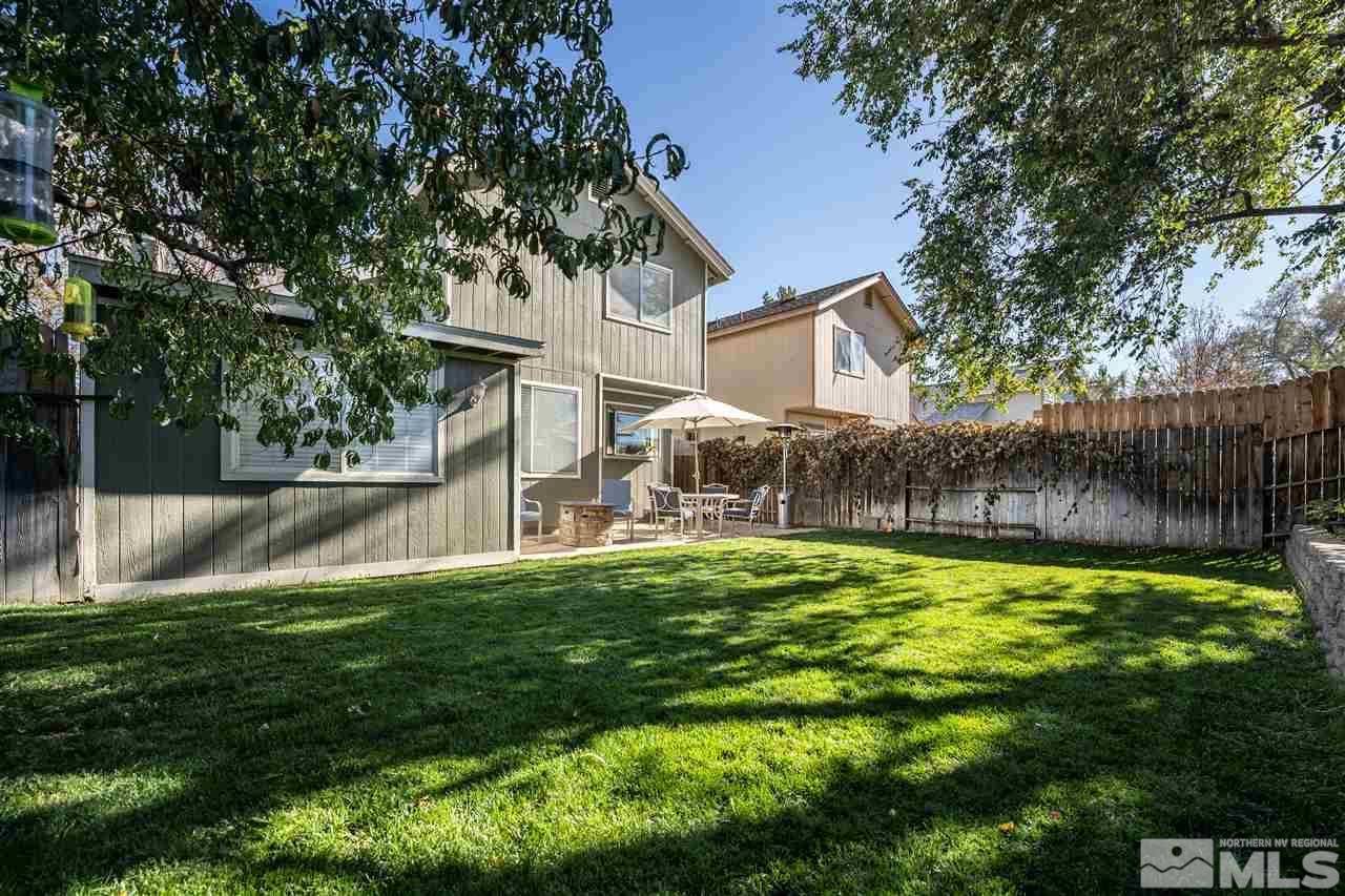 2741 Pajaro Place Reno, NV 89502 - Photo 33 of 36 a backyard with garden and tall trees