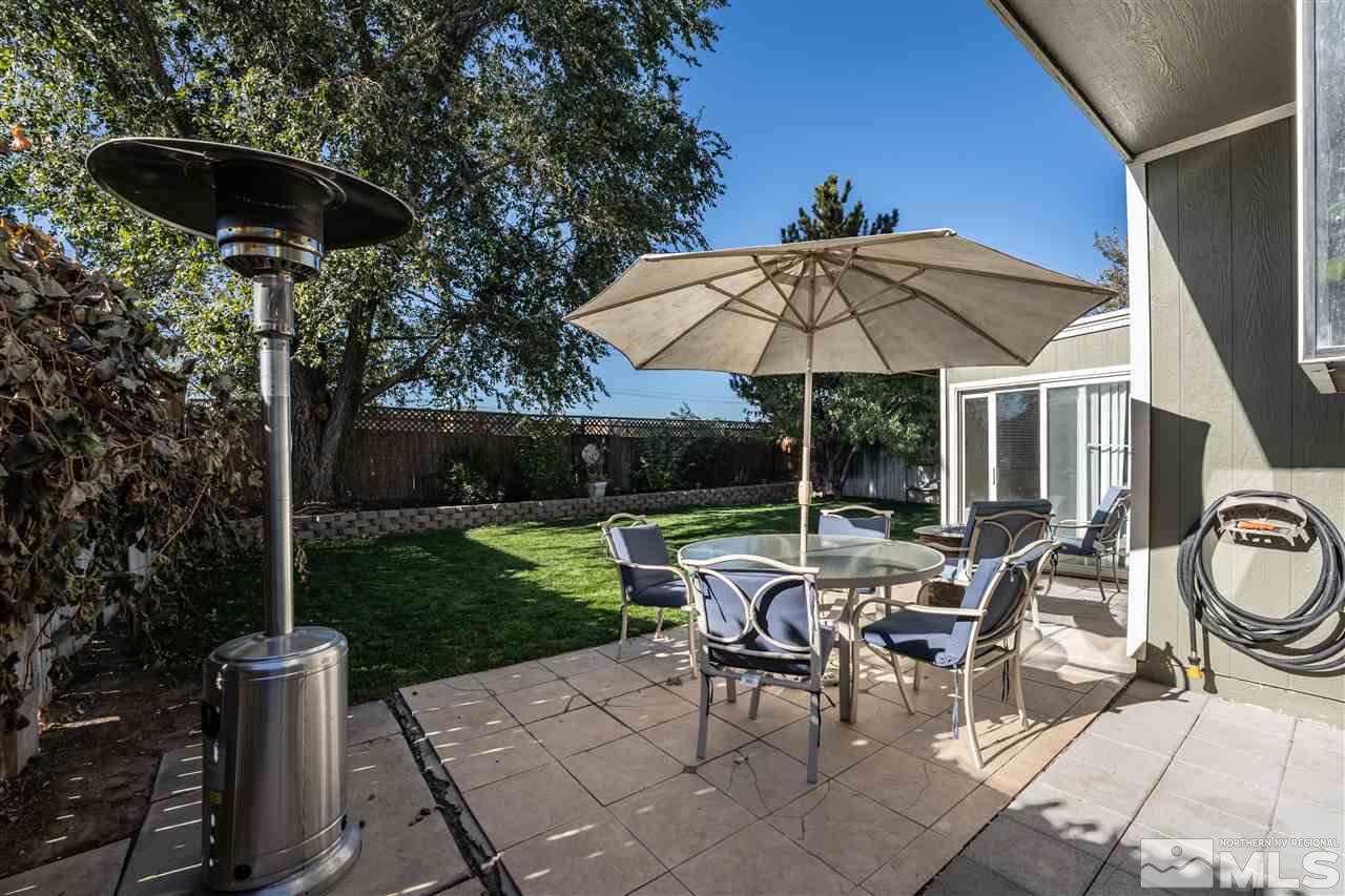 2741 Pajaro Place Reno, NV 89502 - Photo 34 of 36 a patio with a patio table and chairs