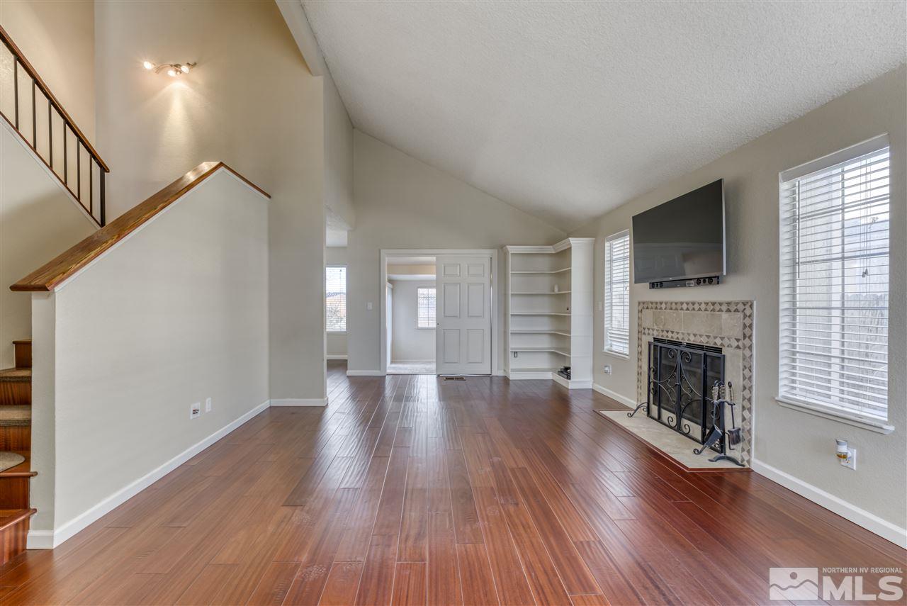 2741 Pajaro Place Reno, NV 89502 - Photo 5 of 36 a view of an empty room with wooden floor and a window