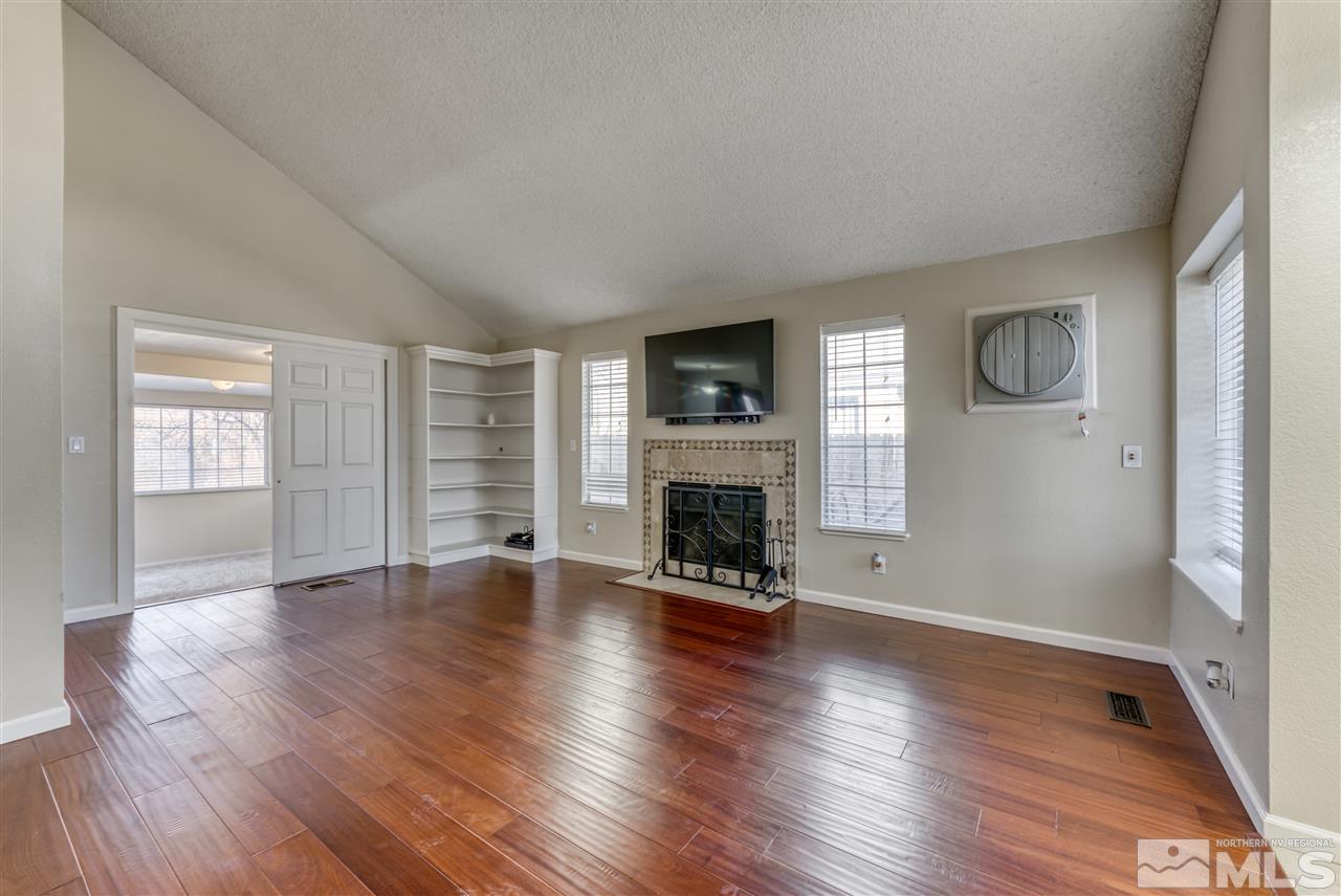 2741 Pajaro Place Reno, NV 89502 - Photo 6 of 36 a view of an empty room with wooden floor and a window