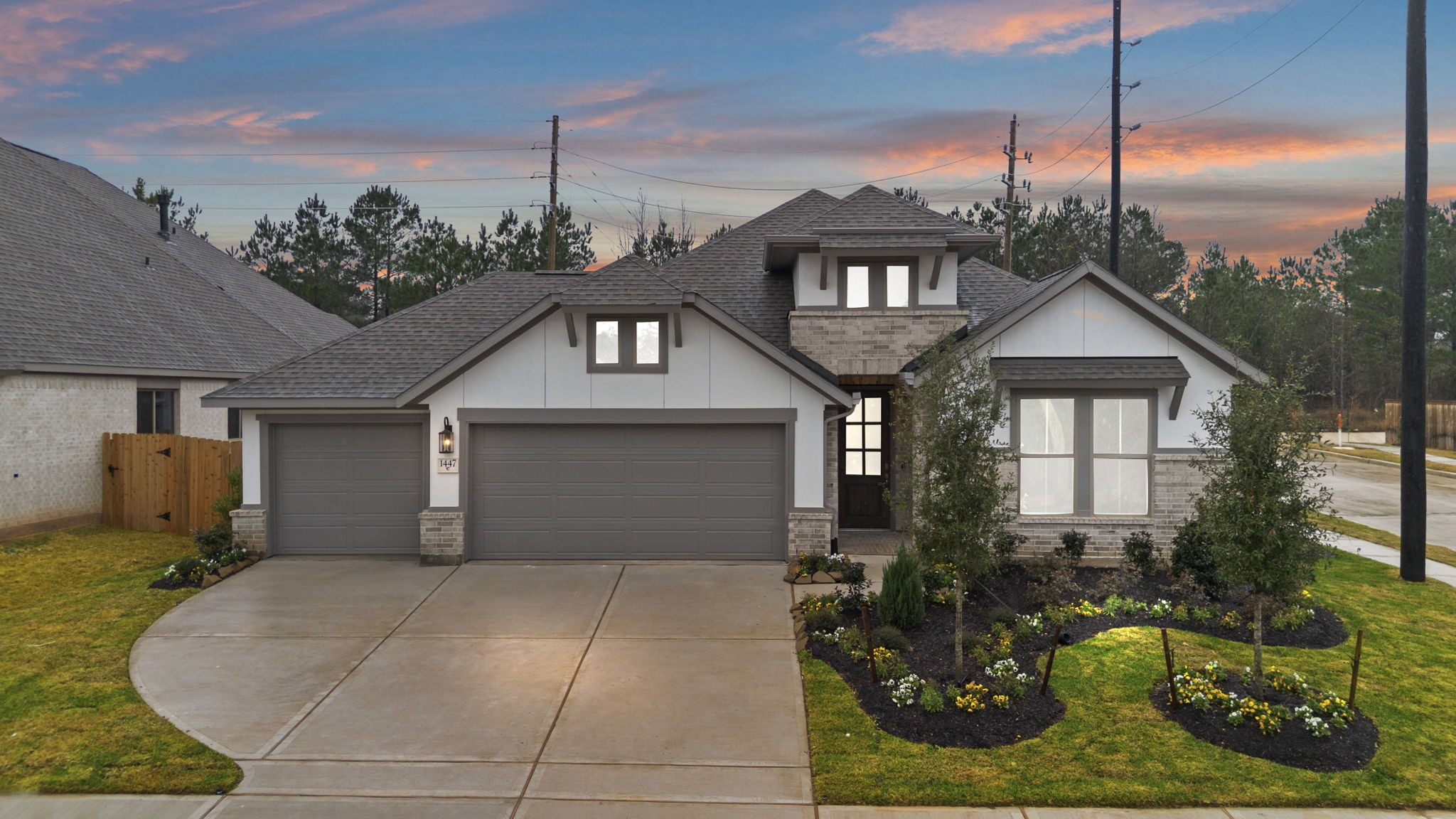 a front view of a house with garden