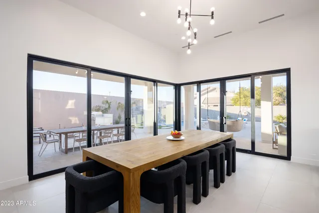 a view of a dining room with furniture window and outside view