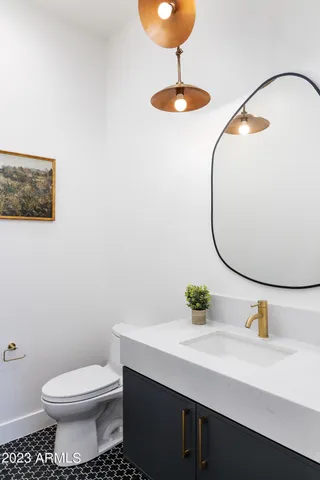 a living room with blue lights with furniture