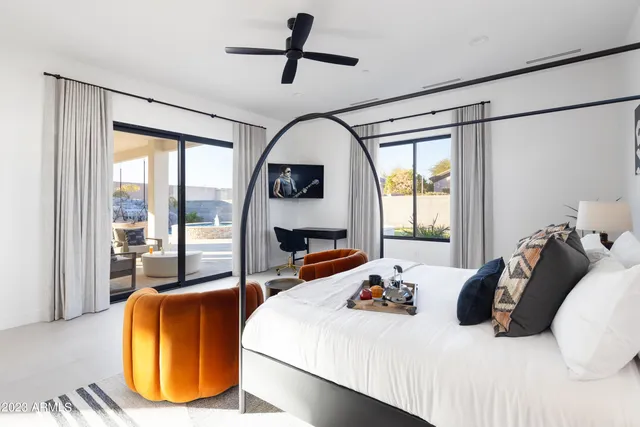 a white tub sitting next to a white wall