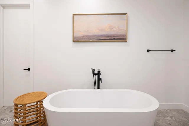 a bedroom with bed and cupboard