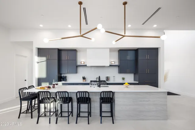 a kitchen with a table and chairs in it