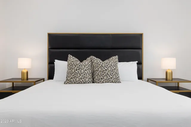 a view of a house with swimming pool and sitting area