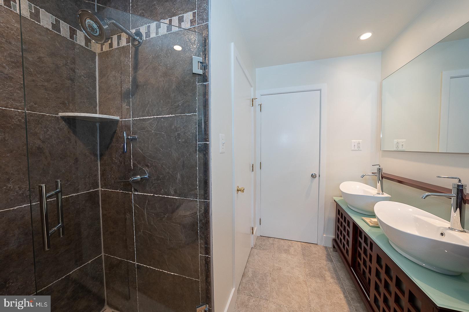 820 Weadley Road Radnor, PA 19087 - Photo 33 of 39 Hall Bath with a two sink vanity