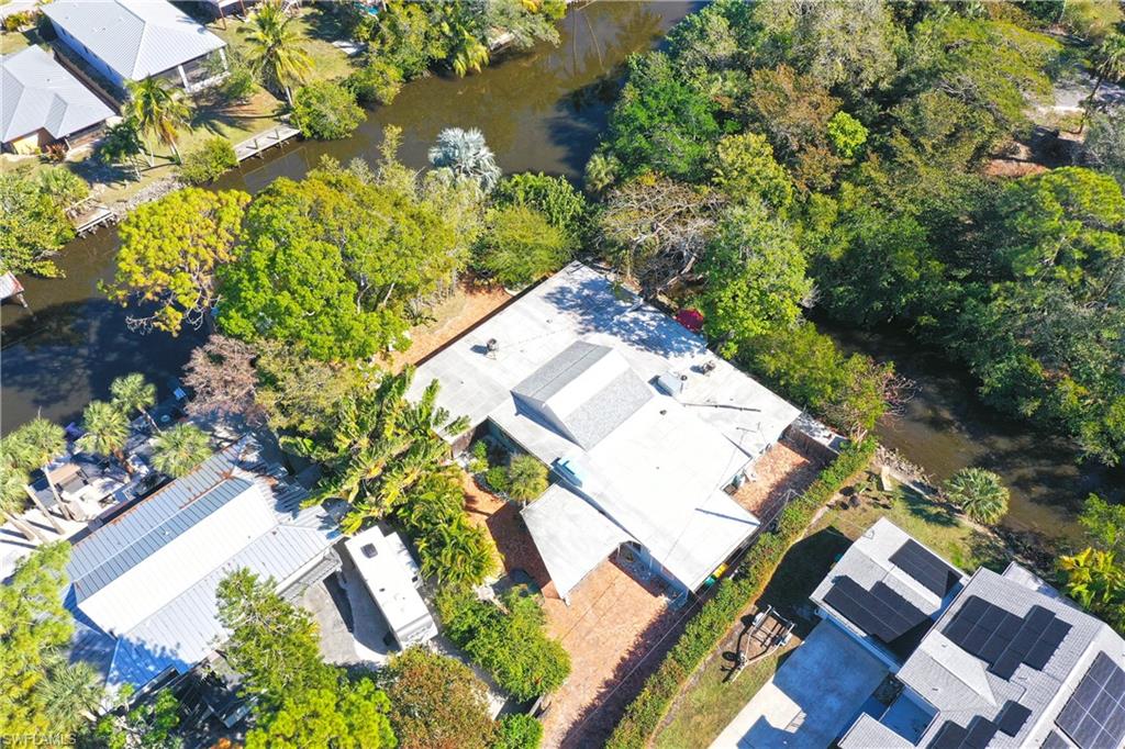 3113 Basin Street Naples, FL 34112 - Photo 1 of 49 an aerial view of a house with a yard and garden