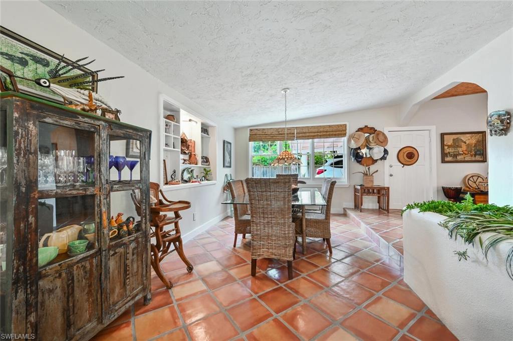 3113 Basin Street Naples, FL 34112 - Photo 20 of 49 a view of a dining room with furniture
