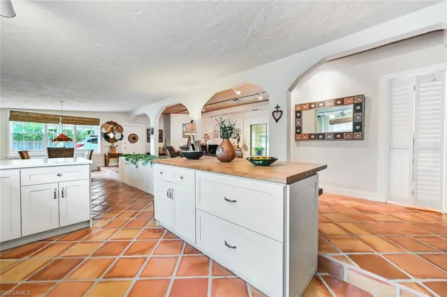 a spacious bathroom with a double vanity sink and a mirror