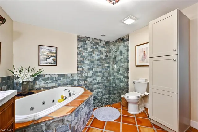 a bathroom with a bathtub toilet and sink