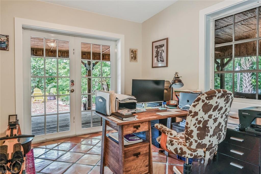 3113 Basin Street Naples, FL 34112 - Photo 34 of 49 a view of a workspace with furniture and a window