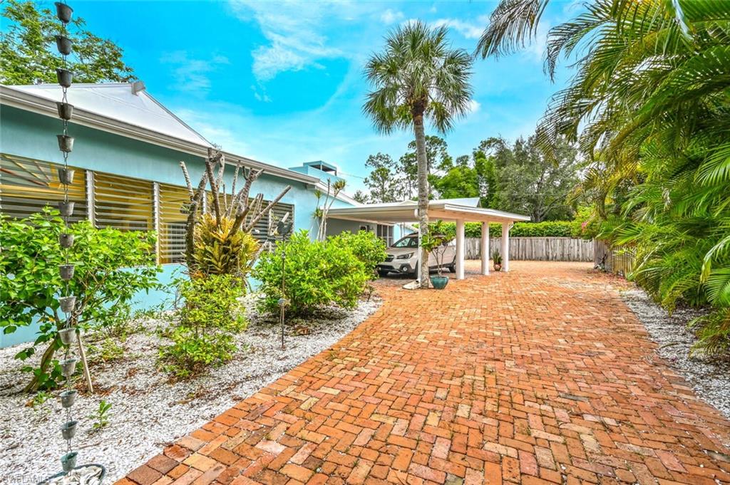 3113 Basin Street Naples, FL 34112 - Photo 46 of 49 a view of a house with a yard