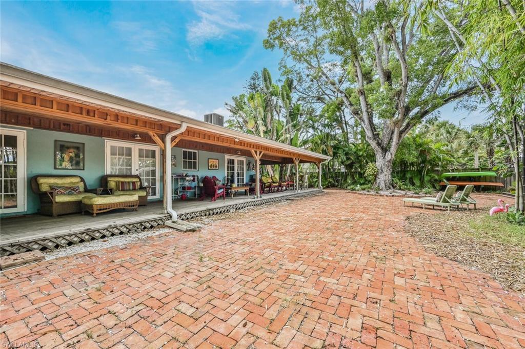3113 Basin Street Naples, FL 34112 - Photo 6 of 49 a view of a house with cars park