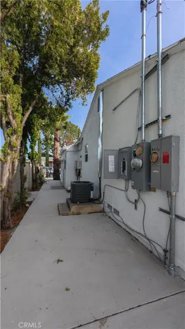 a kitchen with a stove a refrigerator and a sink