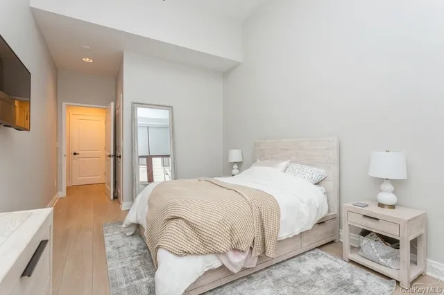 a bedroom with a bed and a table