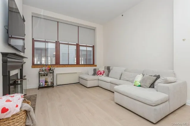 a living room with furniture and a window