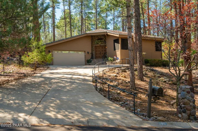 a view of house with yard