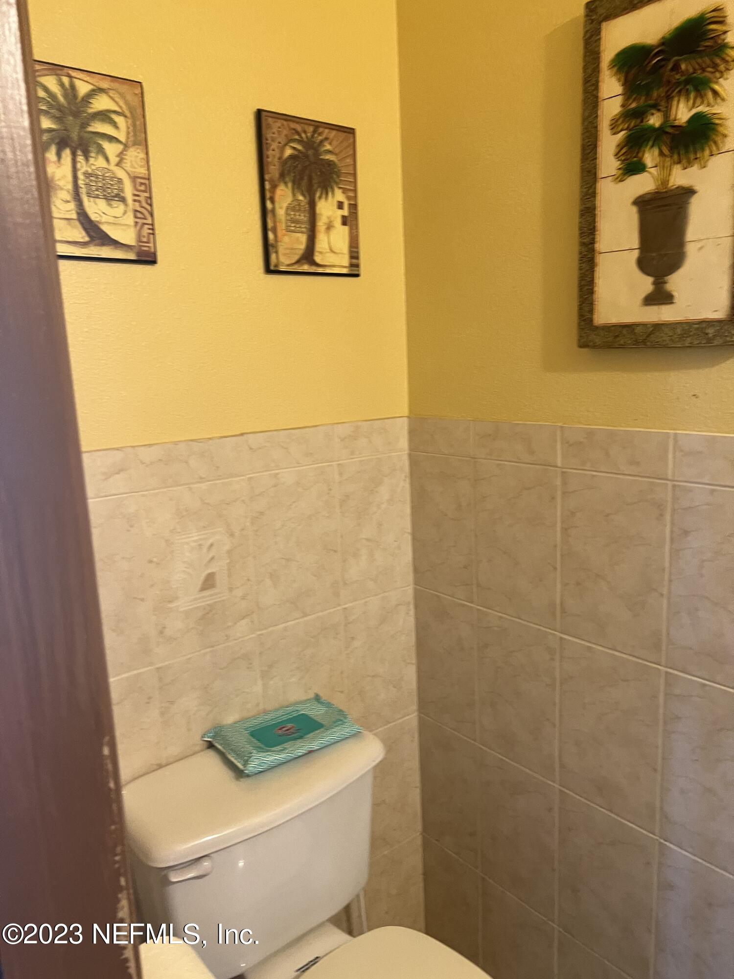 7388 Spring Hill Road Jacksonville, FL 32244 - Photo 12 of 28 a bathroom with a toilet and a shower