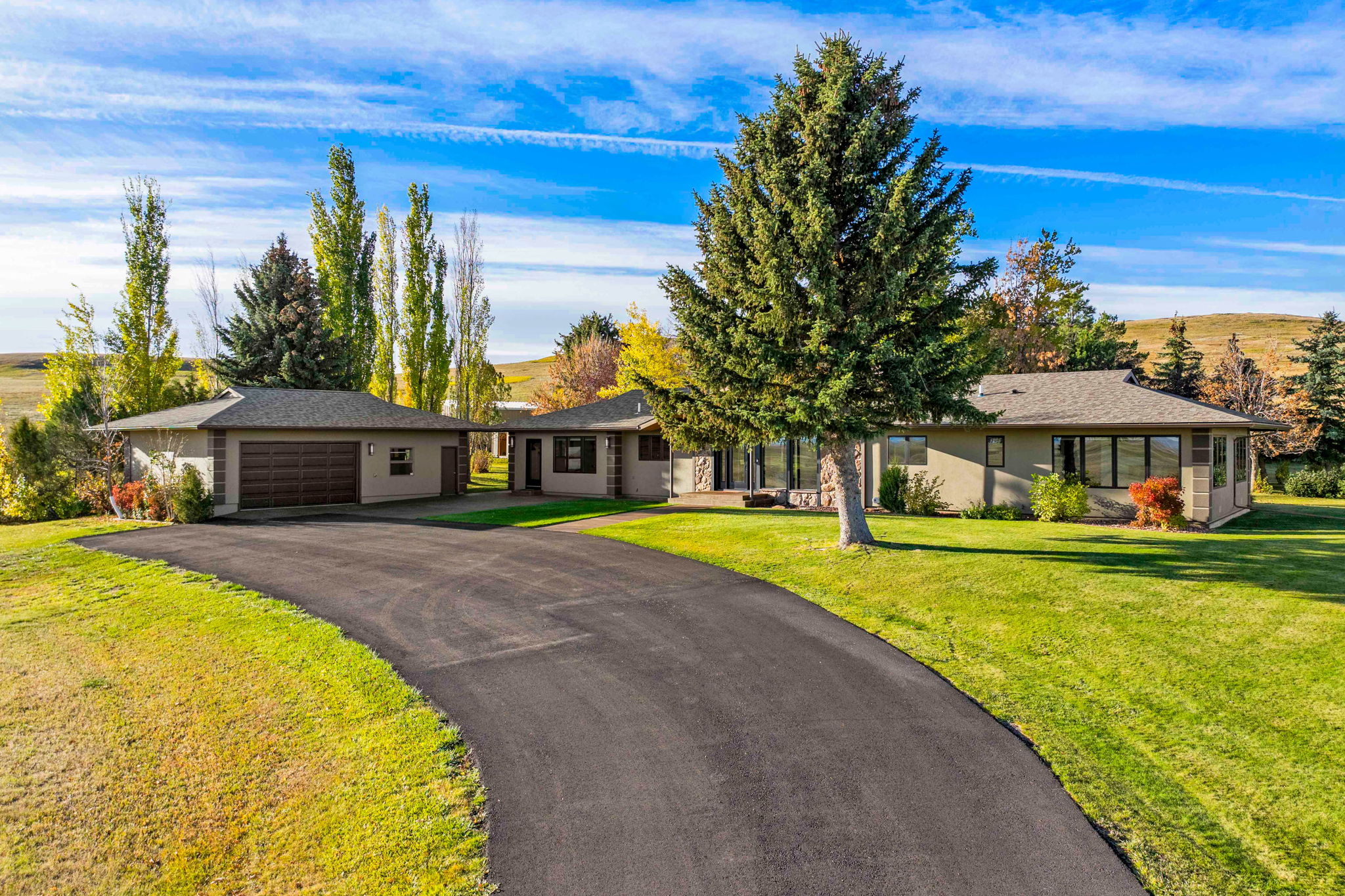 198 East Hunter Road Sand Coulee, MT 59472 - Photo 1 of 1 All one level home featuring a long, paved driveway nestled on 80 acres.