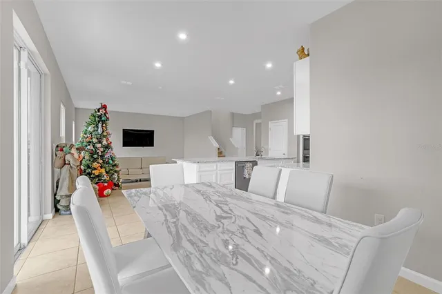 a living room with furniture and flowers