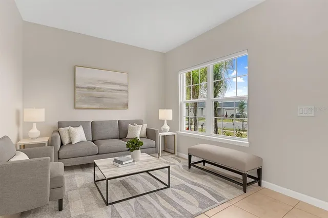 a living room with furniture and a window