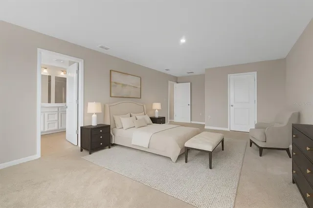 a bedroom with a bed and a view of cabinet