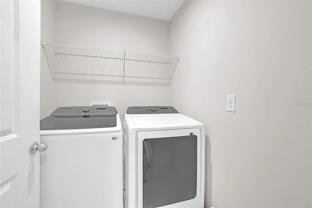 a utility room with dryer and washer
