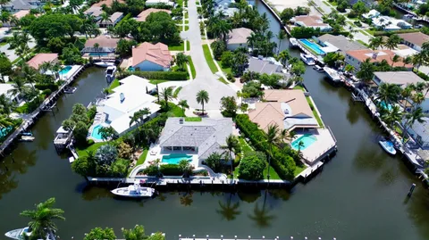 an aerial view of house with yard swimming pool and outdoor seating