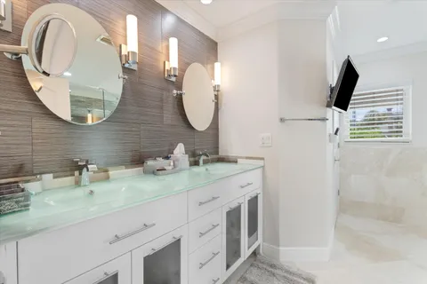 a room with a bed and a chandelier