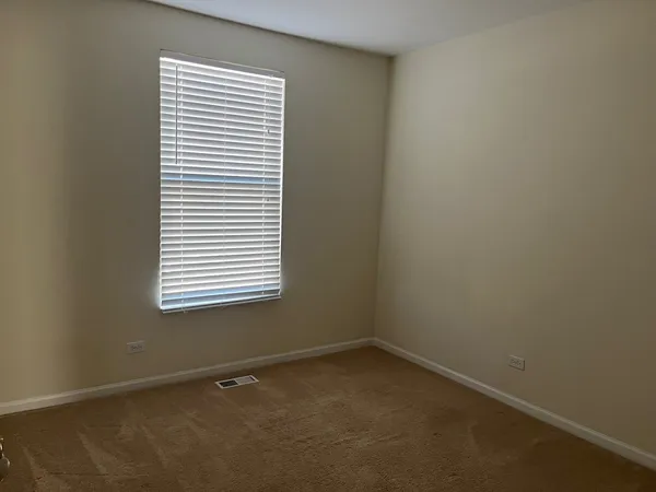 a view of a hallway view with staircase