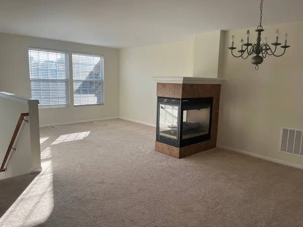 a workspace with fireplace and window