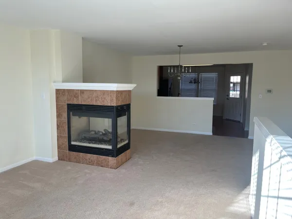a view of a room with a fireplace