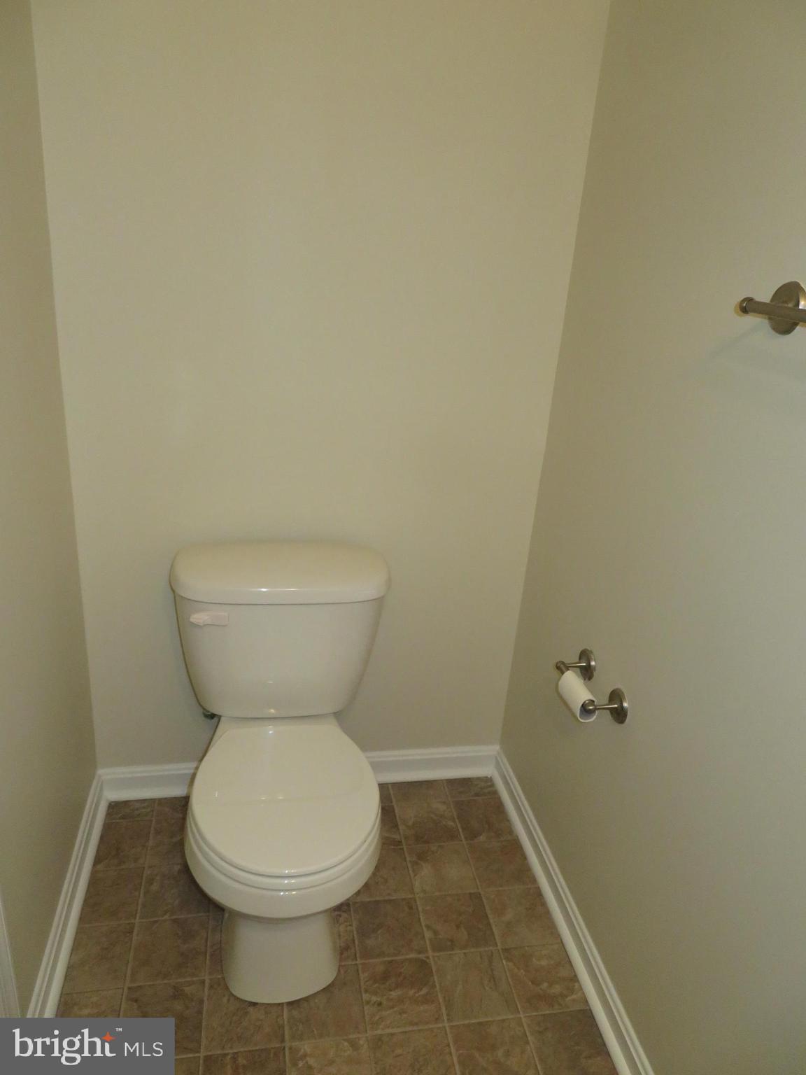 3700 Bedford Drive North Beach, MD 20714 - Photo 11 of 53 a white toilet sitting next to a white sink